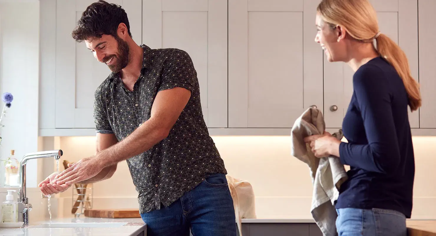 man and woman in kitchen