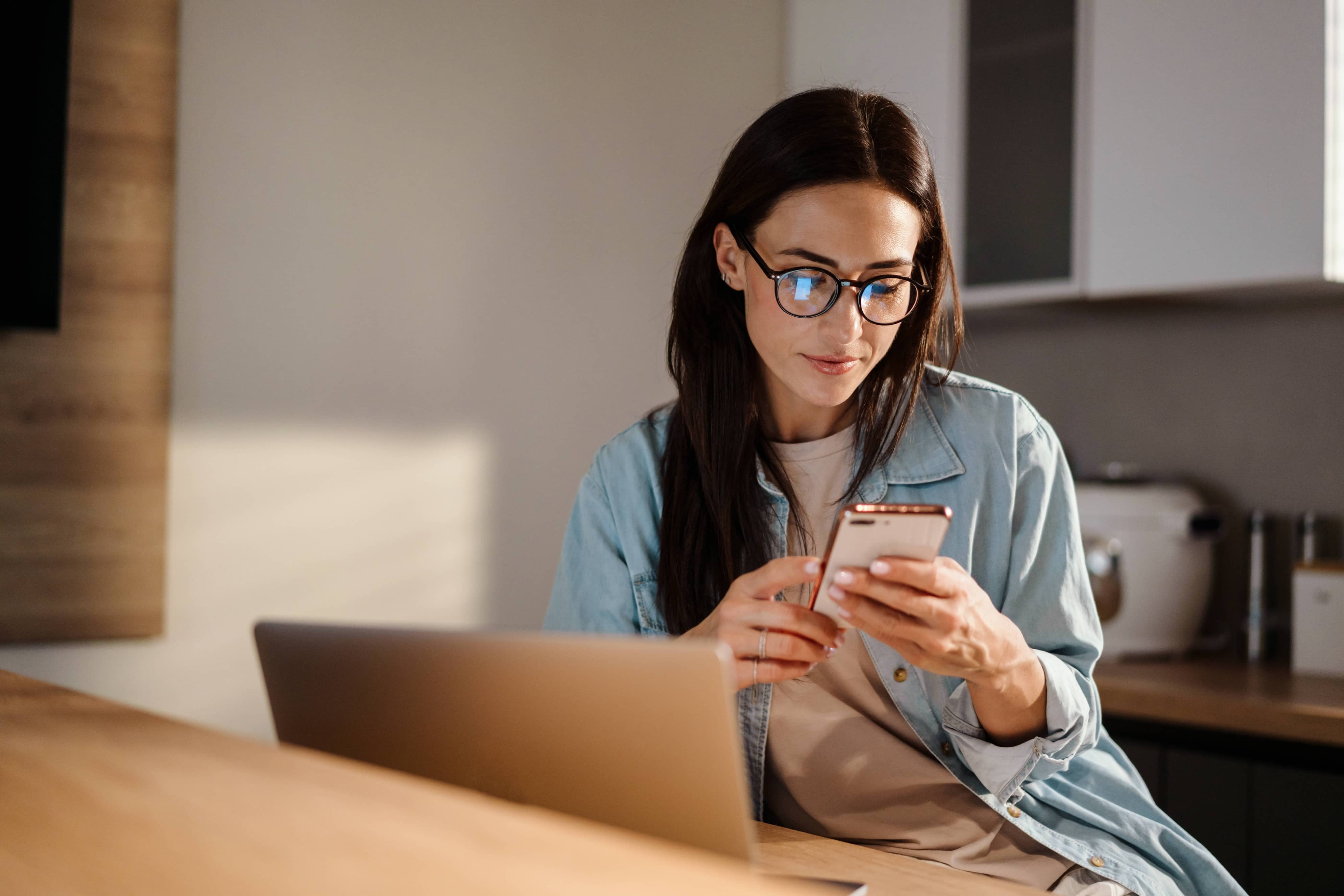 woman checking phone for pricing