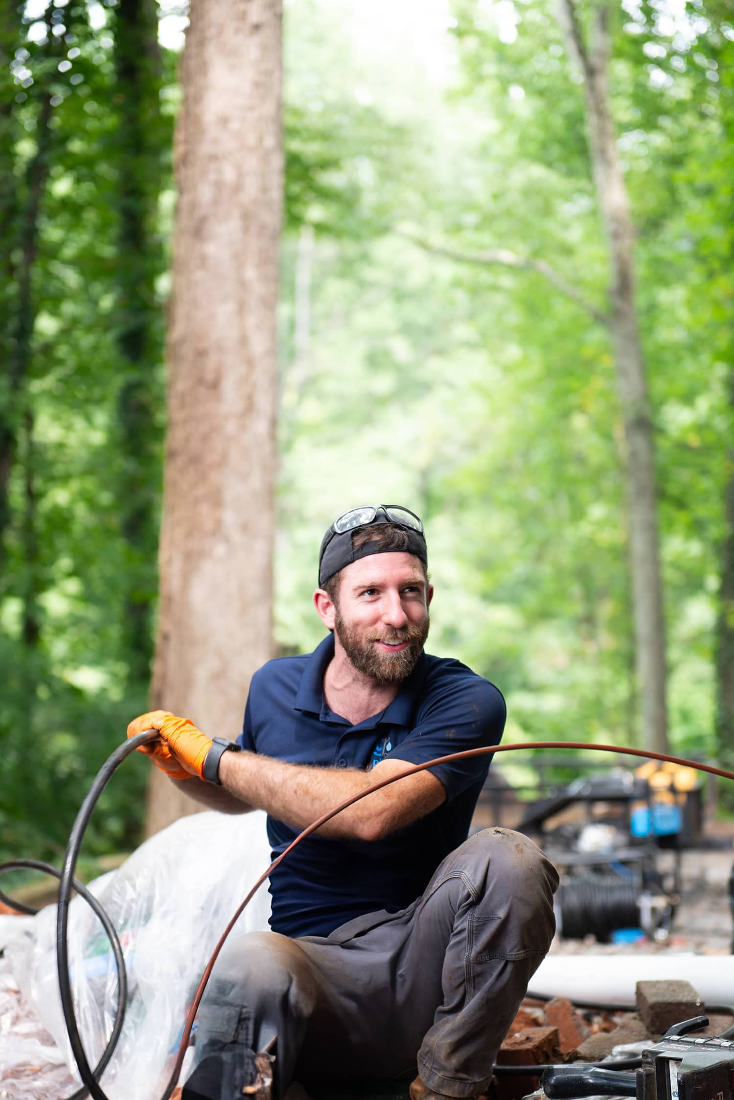 two plumbers in front of a work truck