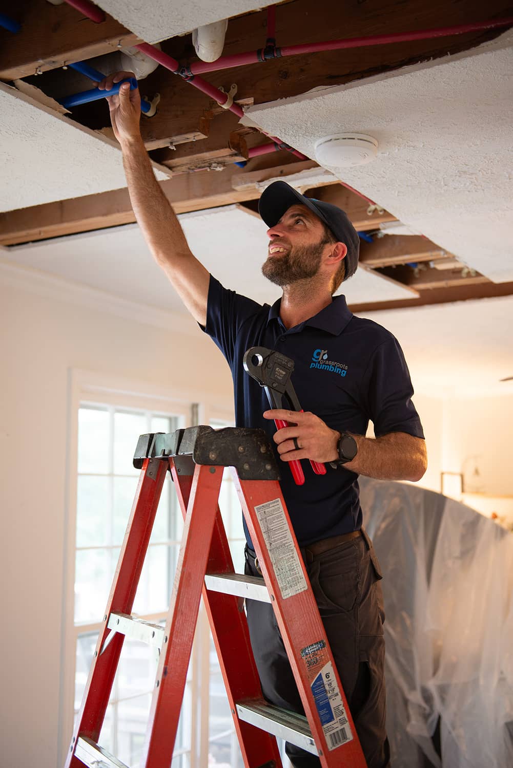 man fixing a leak